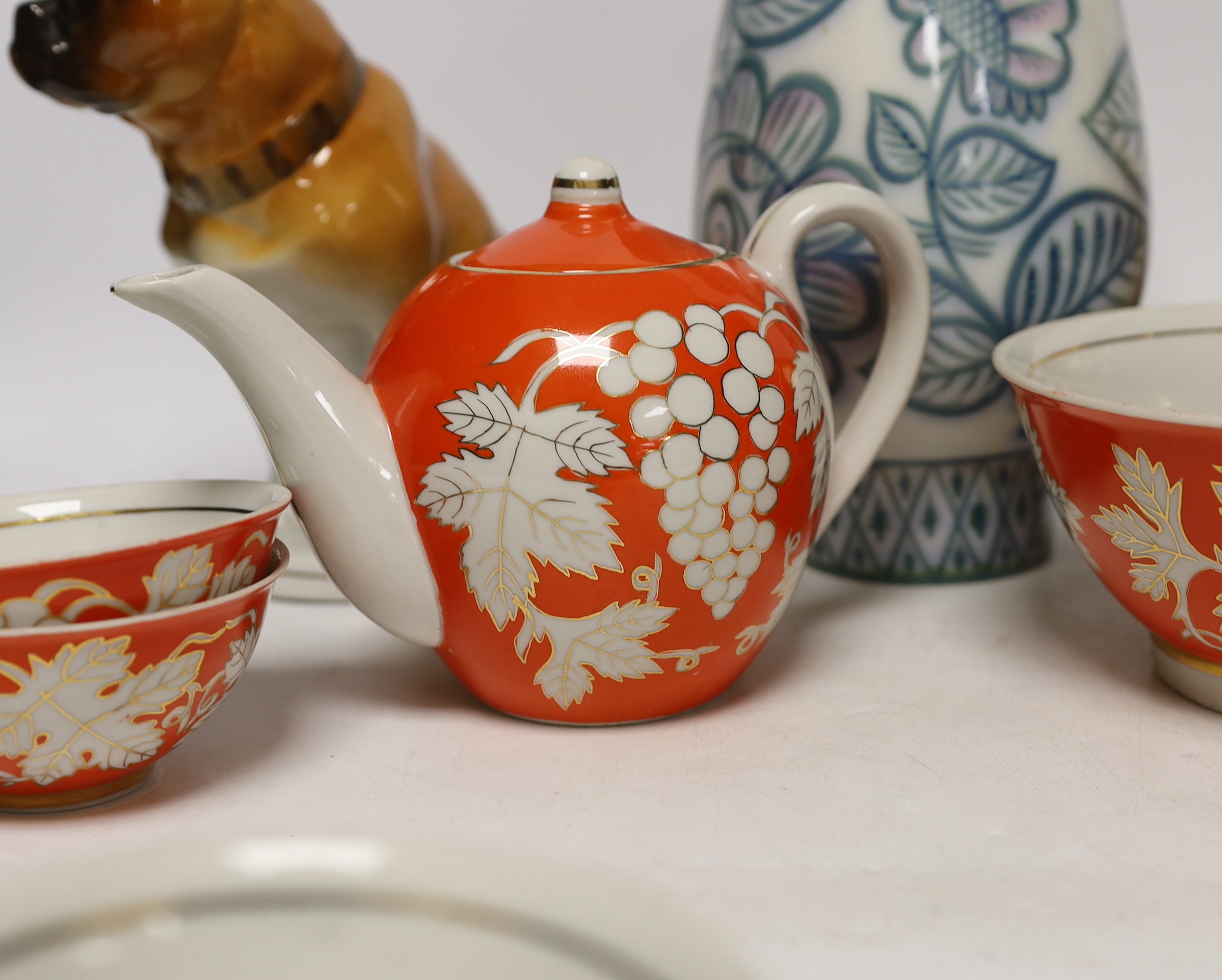 A pair of Russian porcelain models of French bulldogs, a part Chinese (Russian) tea set and a vase